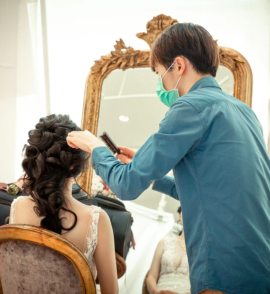 Seb doing a half-updo for a bride.