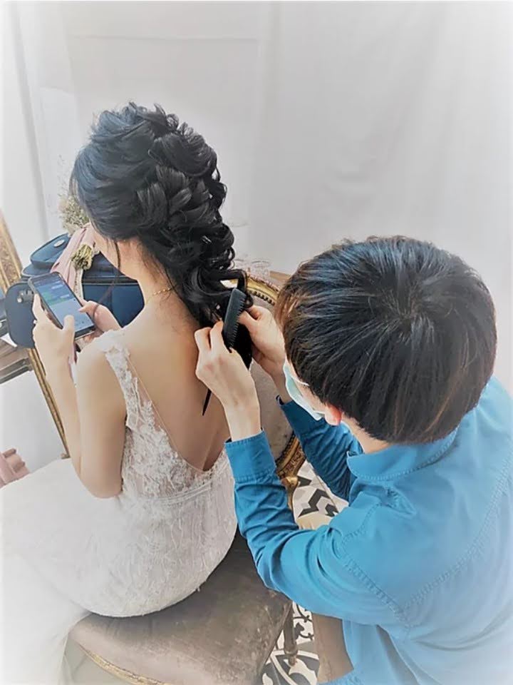 Seb retouching half updo for a bride.