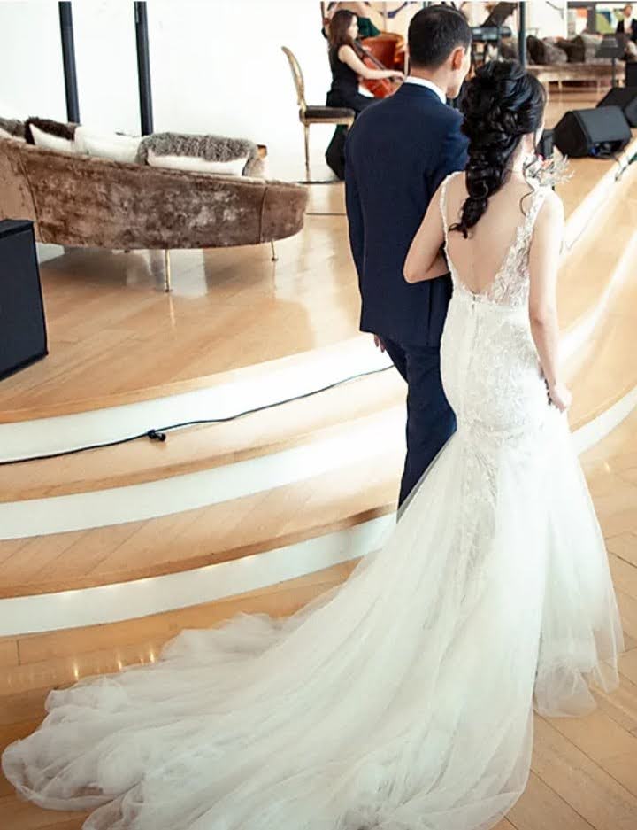 Bride entering with romantic half updo.