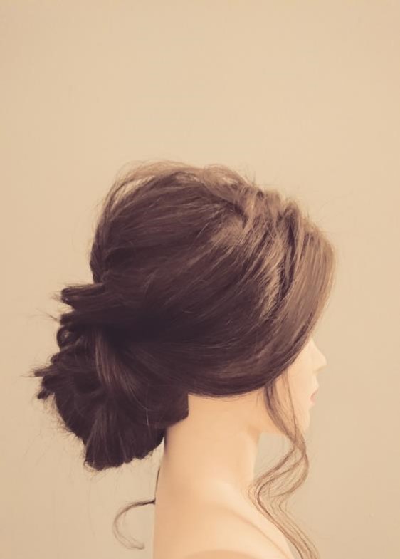 Low bun bridal updo.